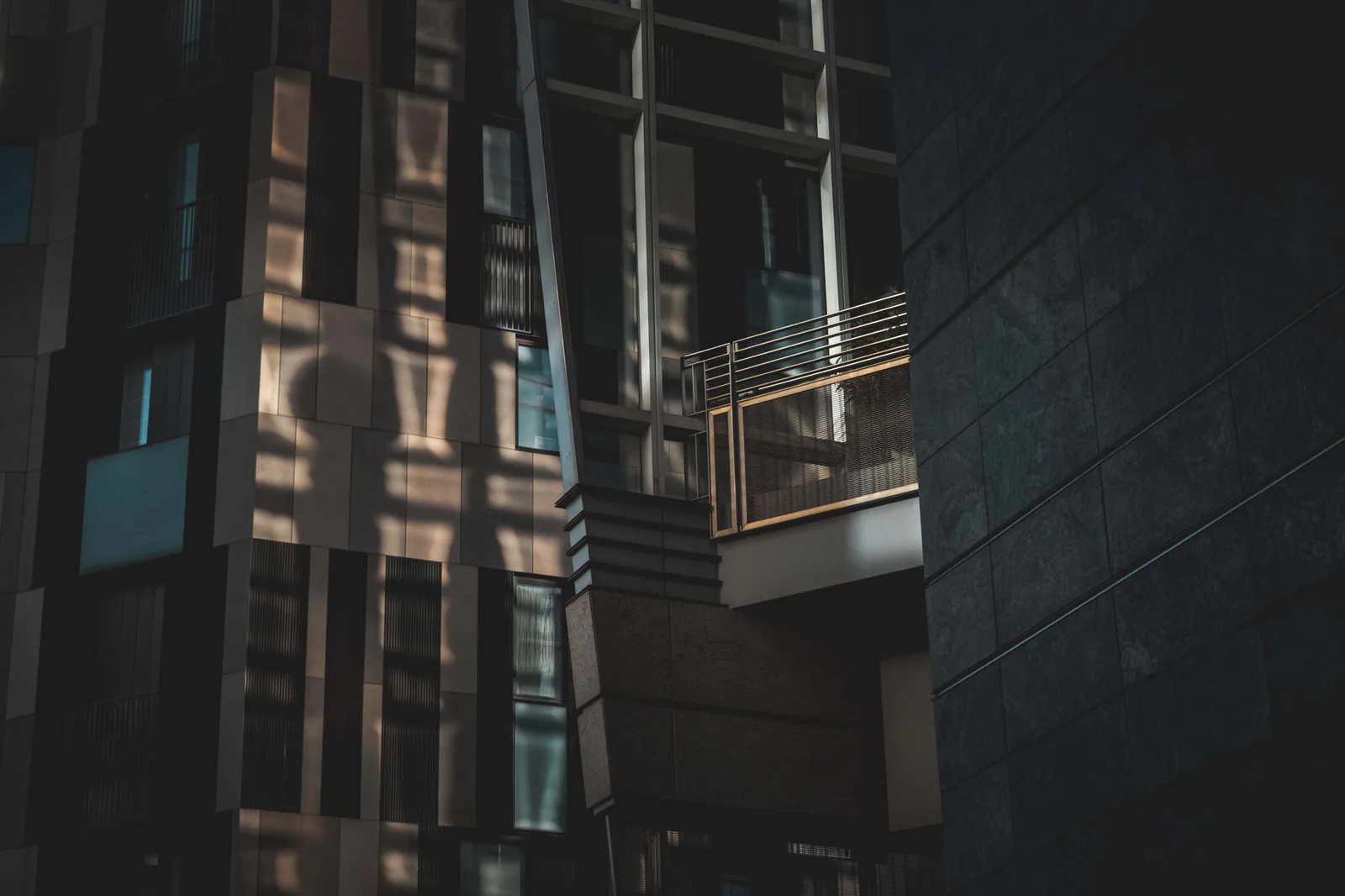 Dark moody view of a modern commercial building exterior at night
